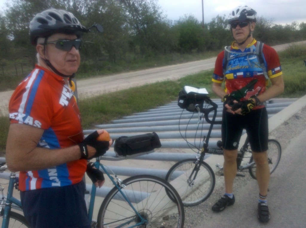 Tim and Mark on final rest stop of Leg 3.  We stopped at a rain drainage culvert along US 90.  The steel bars are there to keep any large solid objects from entering the culvert with the water and clogging it up. 